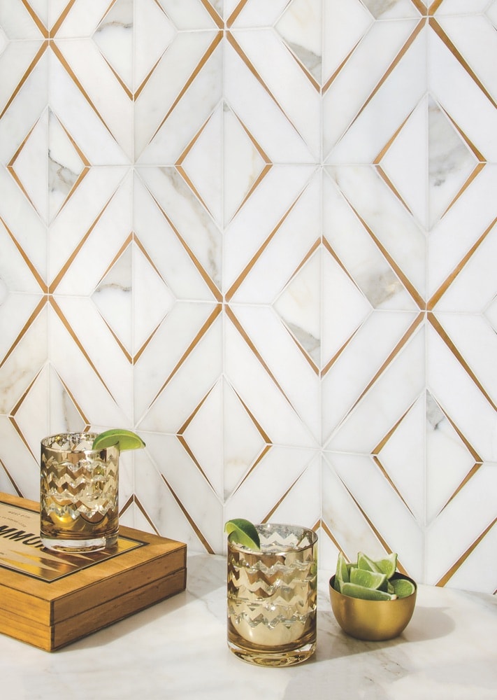 Reve, a handmade mosaic shown in 24-karat Gold Glass and Agate and Quartz Jewel Glass, is part of the Aurora collection by Sara Baldwin for New Ravenna.