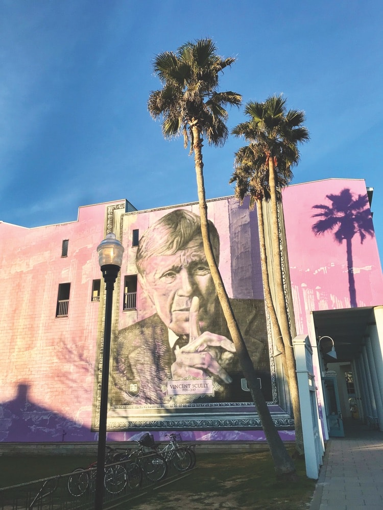 Street artist Gaia painted this mural commemorating architect and professor Vincent Scully on the iconic purple wall at 25 Central Square in January of 2018. Photo by Jordan Staggs