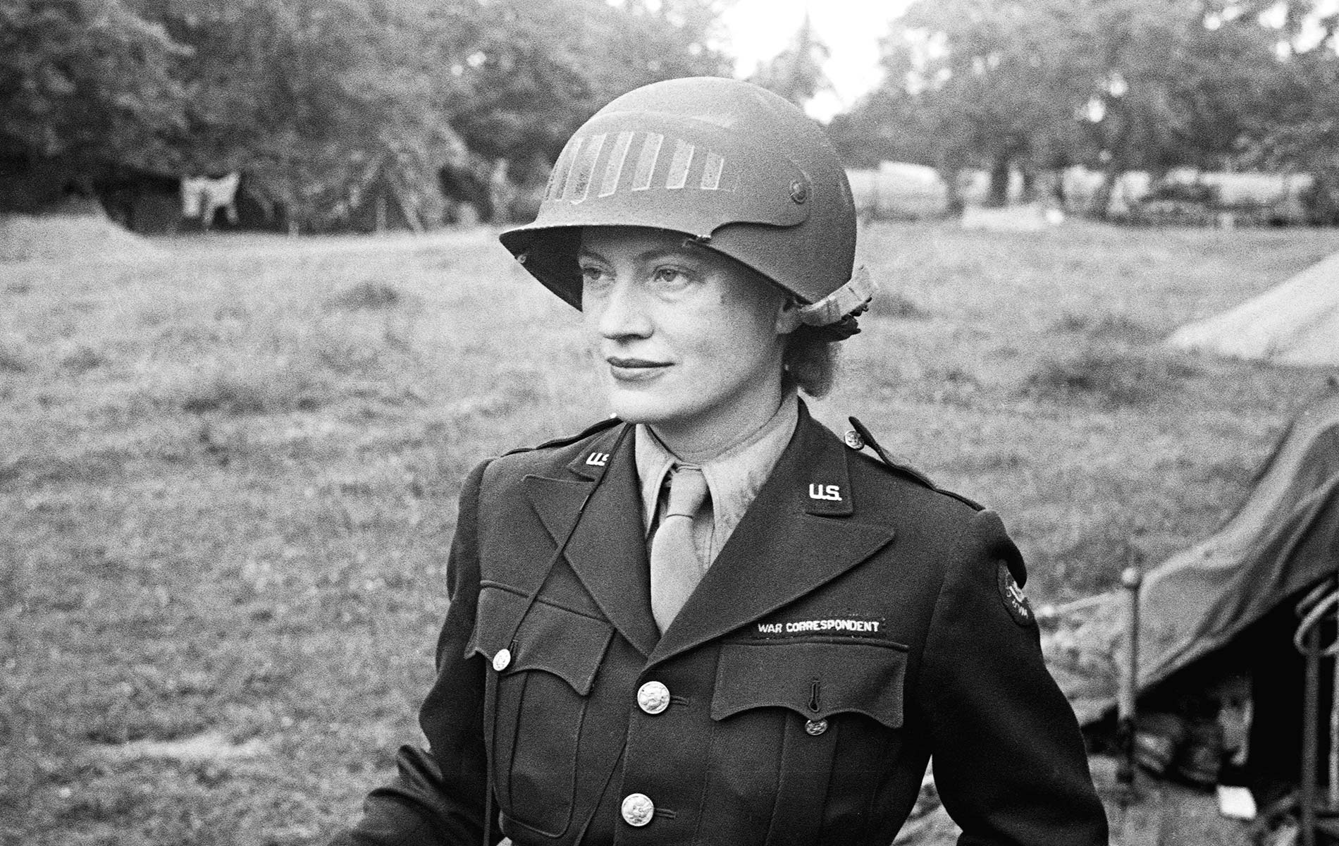Lee Miller in steel helmet specially designed for using a camera, Normandy, France 1944