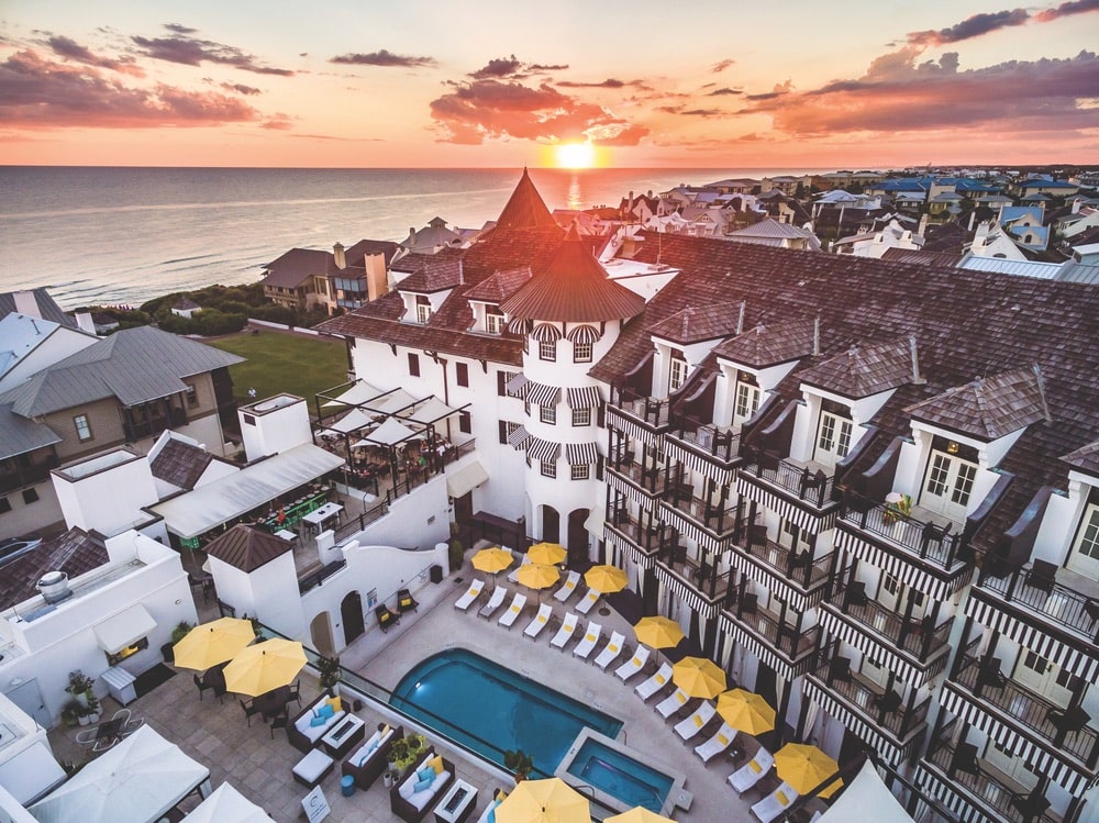 Upper view of The Pearl Hotel's pool and rooftop lounge in Rosemary Beach, Florida at sunset