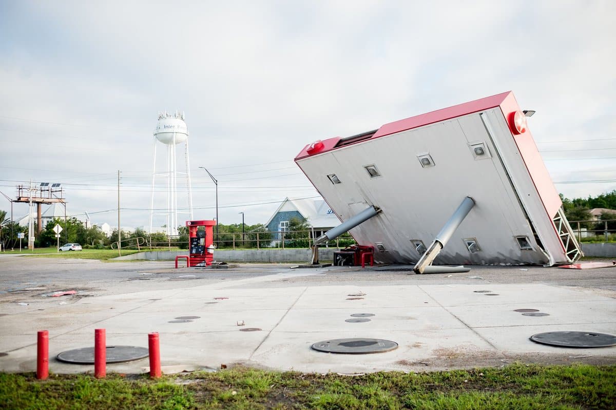 The overhang of a gas station is toppled over in the aftermath of Hurricane Michael on October 11, 2018 in Inlet Beach, Florida.