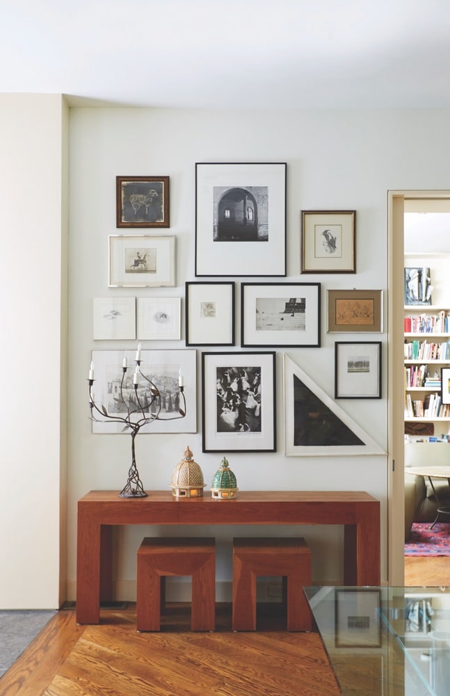 Collection of art on the wall at Paula Lambert's Turtle Creek home in Dallas, Texas