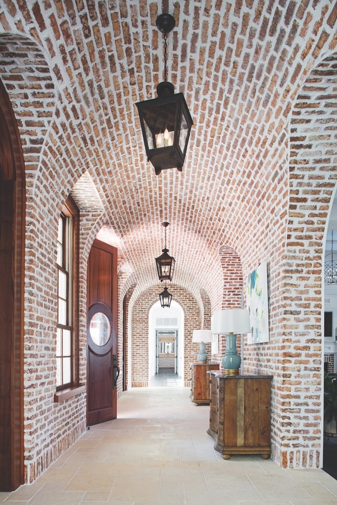 Beautiful, arched hallway completely covered in red brick shot by Richard Leo Johnson