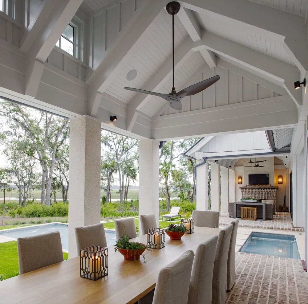 Outdoor eating area overlooking the pool and white woodwork shot by Richard Leo Johnson