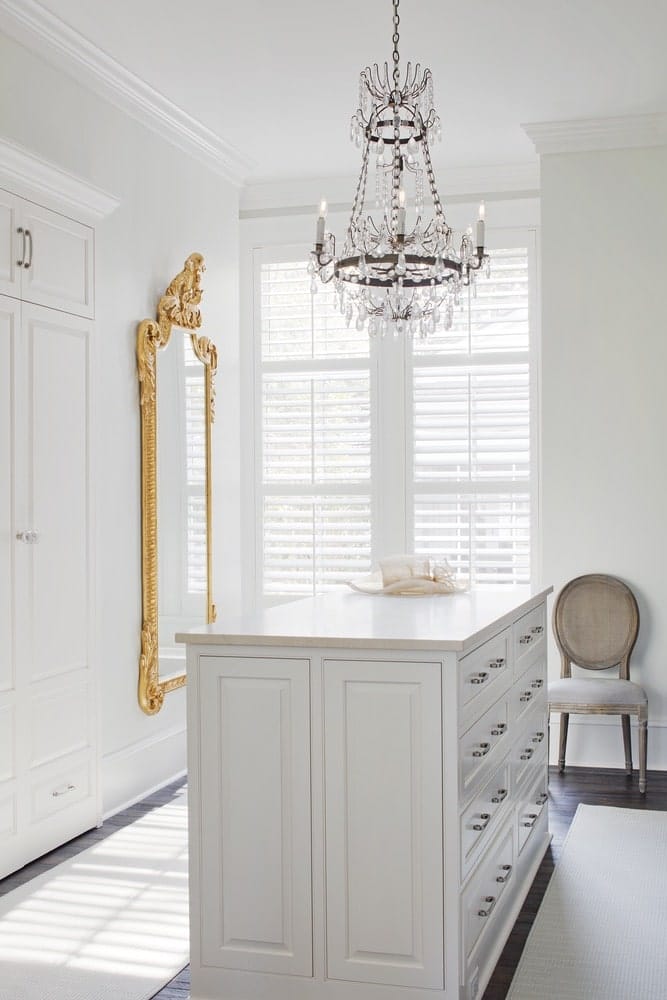 White closet with a gold mirror on the wall shot by Richard Leo Johnson
