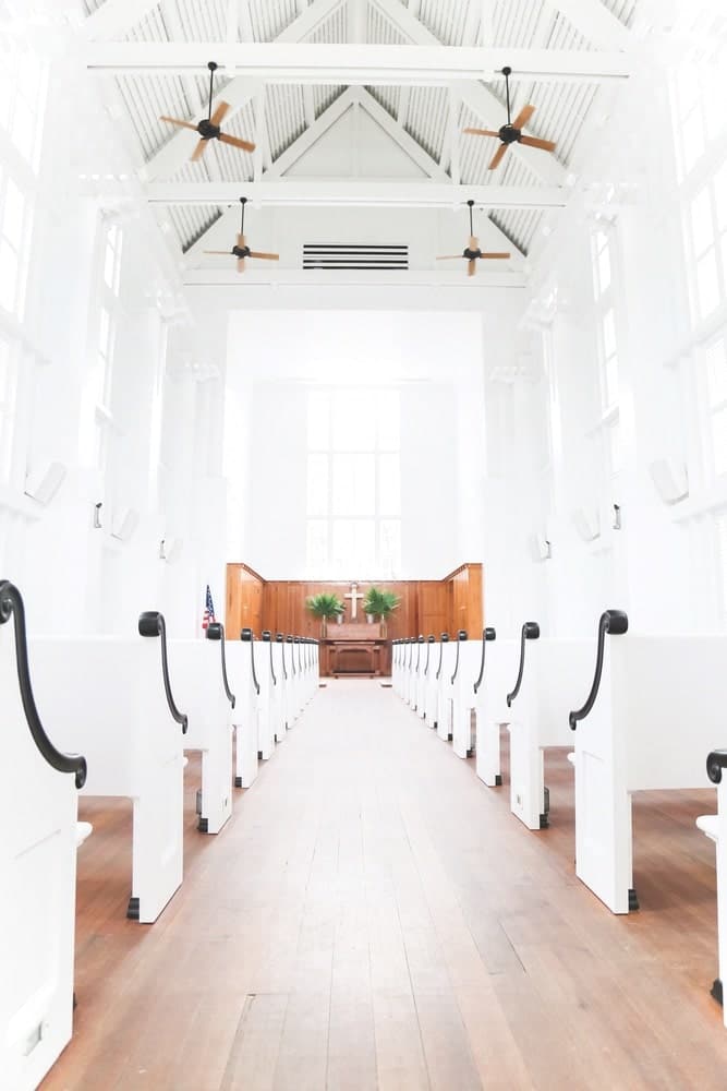The Chapel at Seaside, one of the New Urbanist town’s most iconic structures, features E. F. San Juan custom millwork beams, bell tower, and other details. | Photo by Brenna Kneiss