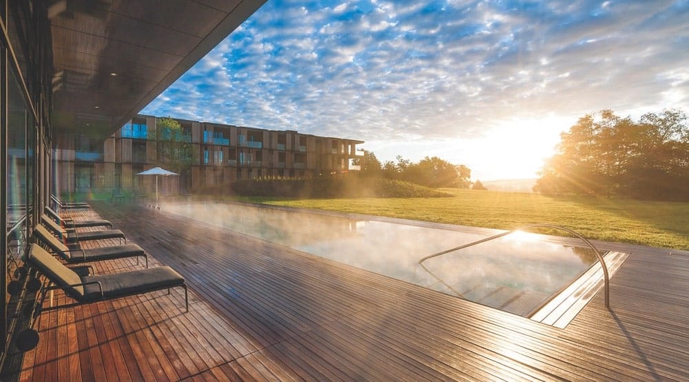 Germany’s Lanserhof Tegernsee resort offers chic accommodations, a saltwater pool, a medical spa, and a golf course. | Photo courtesy of Lanserhof Tegernsee