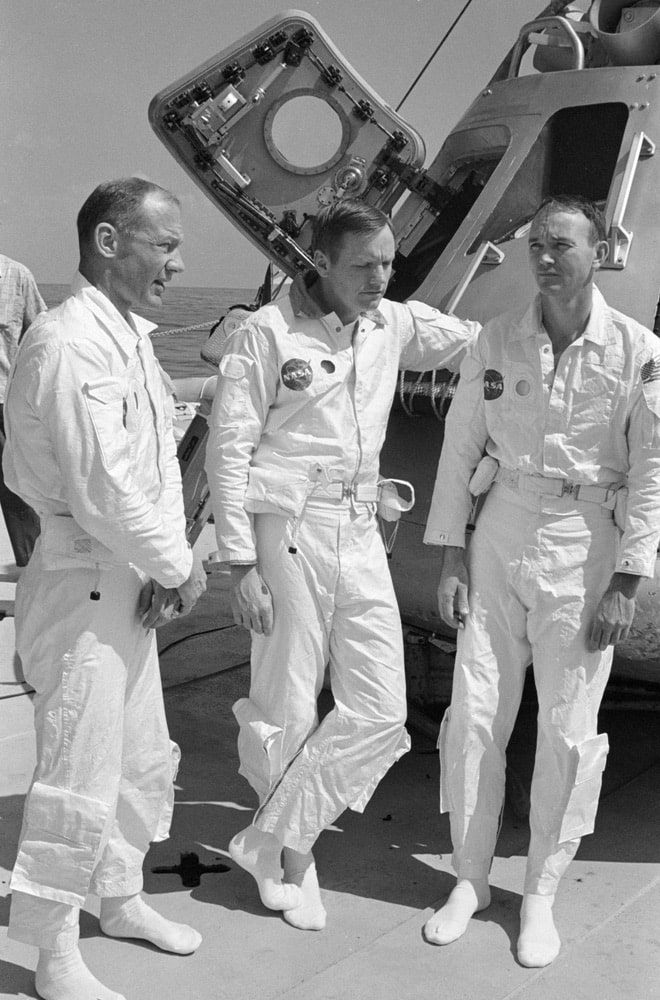 The prime crew of the Apollo 11 lunar landing mission relaxes on the deck of the NASA Motor Vessel Retriever prior to participating in water egress training in the Gulf of Mexico. Left to right, are astronauts Edwin E. Aldrin Jr., lunar module pilot; Neil A. Armstrong, commander; and Michael Collins, command module pilot. In the background is Apollo Boilerplate 1102 which was used in the training exercise. nasa, apollo 11 50th anniversary