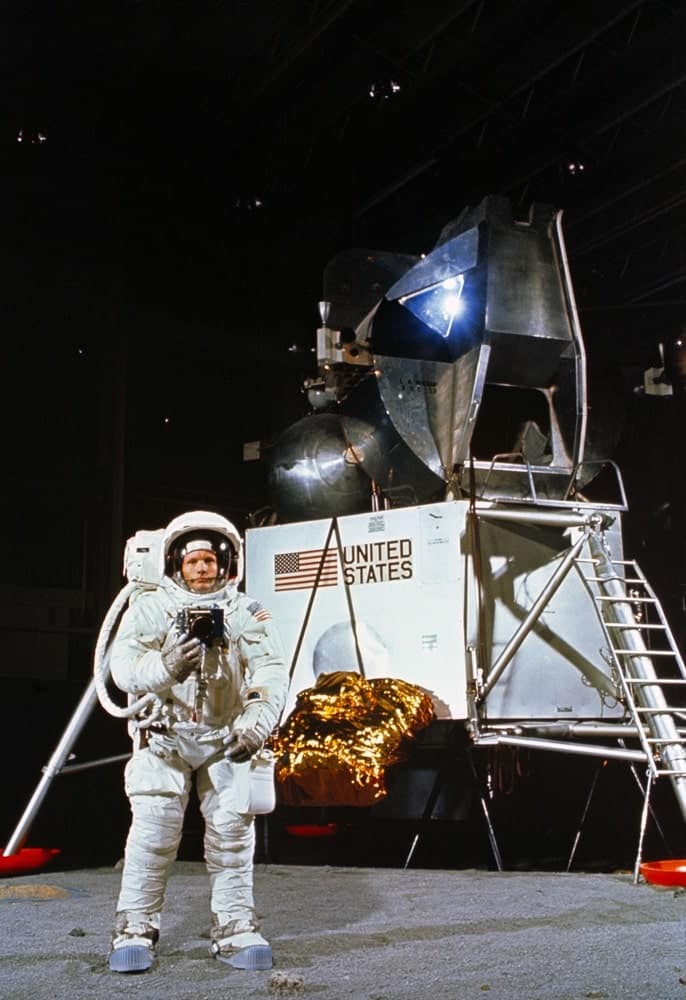 Astronaut Neil A. Armstrong, wearing an Extravehicular Mobility Unit, participates in a simulation of deploying and using lunar tools on the surface of the moon during a training exercise in Building 9 on April 22, 1969. Armstrong is the commander of the Apollo 11 lunar landing mission. In the background is a Lunar Module mock-up. nasa, apollo 11 50th anniversary