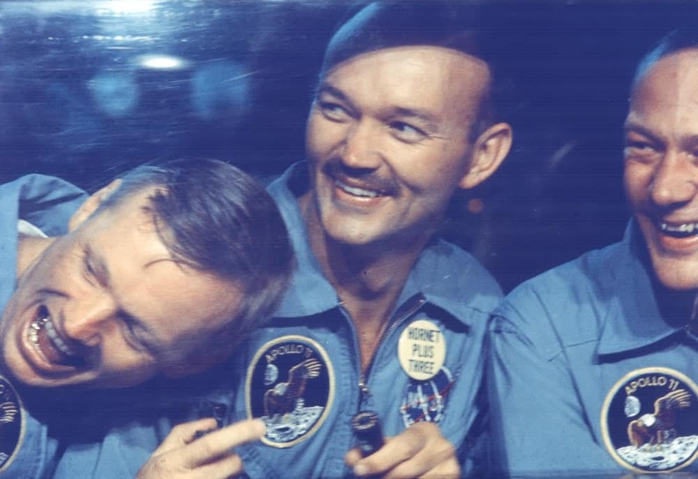The Apollo 11 astronauts, left to right, Neil A. Armstrong, Michael Collins and Edwin E. Aldrin Jr. share jokes with well-wishers on the other side of the window of their Mobile Quarantine Facility aboard the USS Hornet. The astronauts splashed down at 12:50 p.m. EDT at the completion of their historical eight-day first manned lunar landing. nasa, apollo 11 50th anniversary