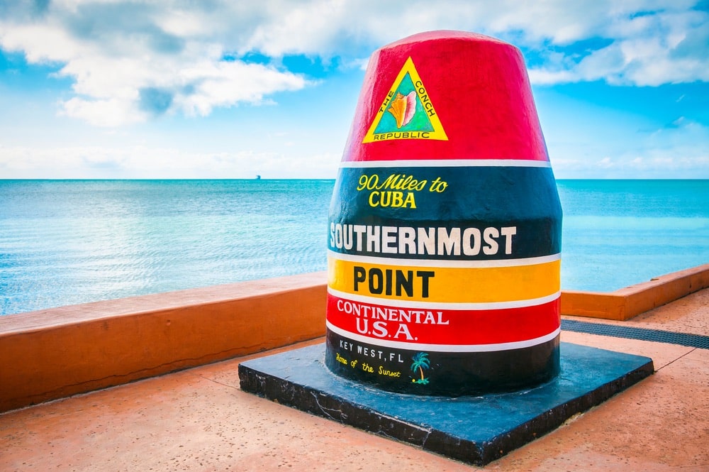 Empty scenic view of the colorful concrete buoy featuring the municipal seal of Key West marking the southernmost point of the continental USA in Florida L