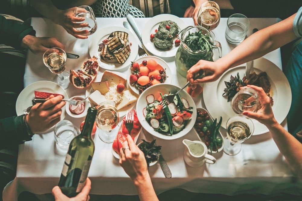 VIE Magazine, Cindy Garrard Column, Party dinner table, celebrating with friends of family served at home or in a restaurant